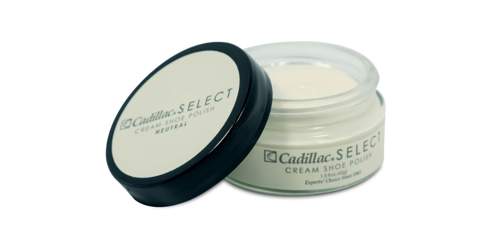 Cadillac White Shoe Polish with half cap open on white background