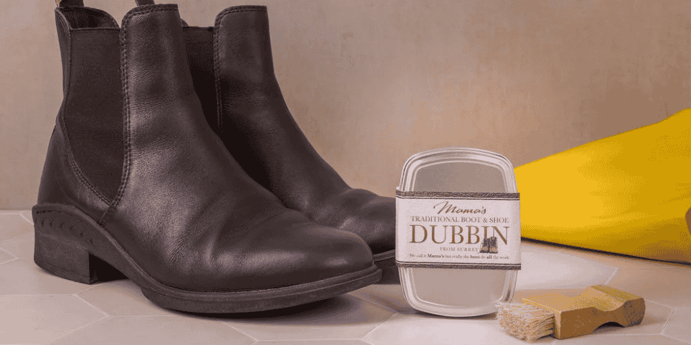 mama's beeswax dubbin along with long leather boots